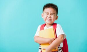 Smiling child at a back-to-school dental exam